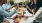 a group of people having a meal
