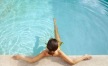  a person sitting in a pool
