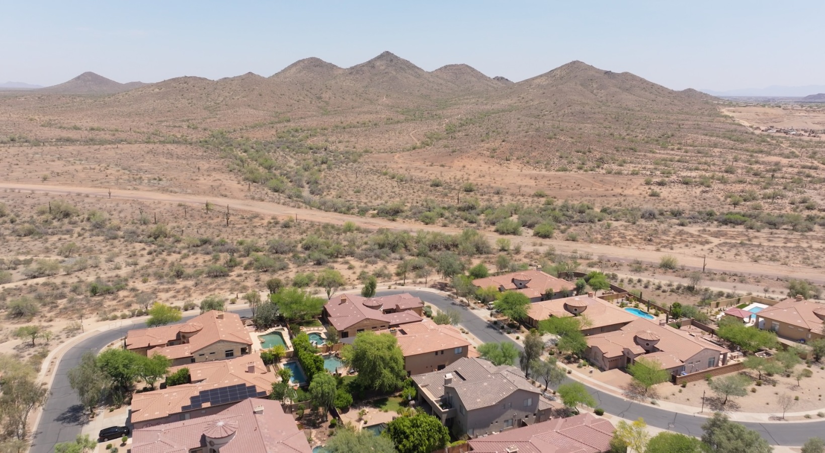 aerial view of homes streets and moutains