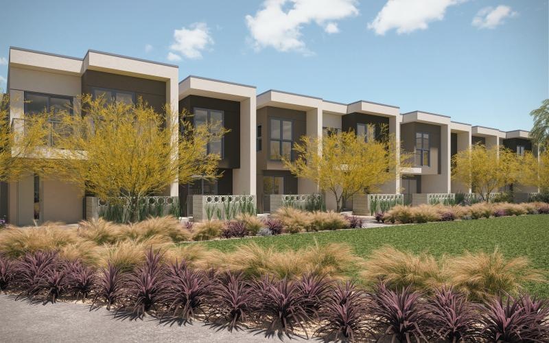 a building with trees and bushes in front of it